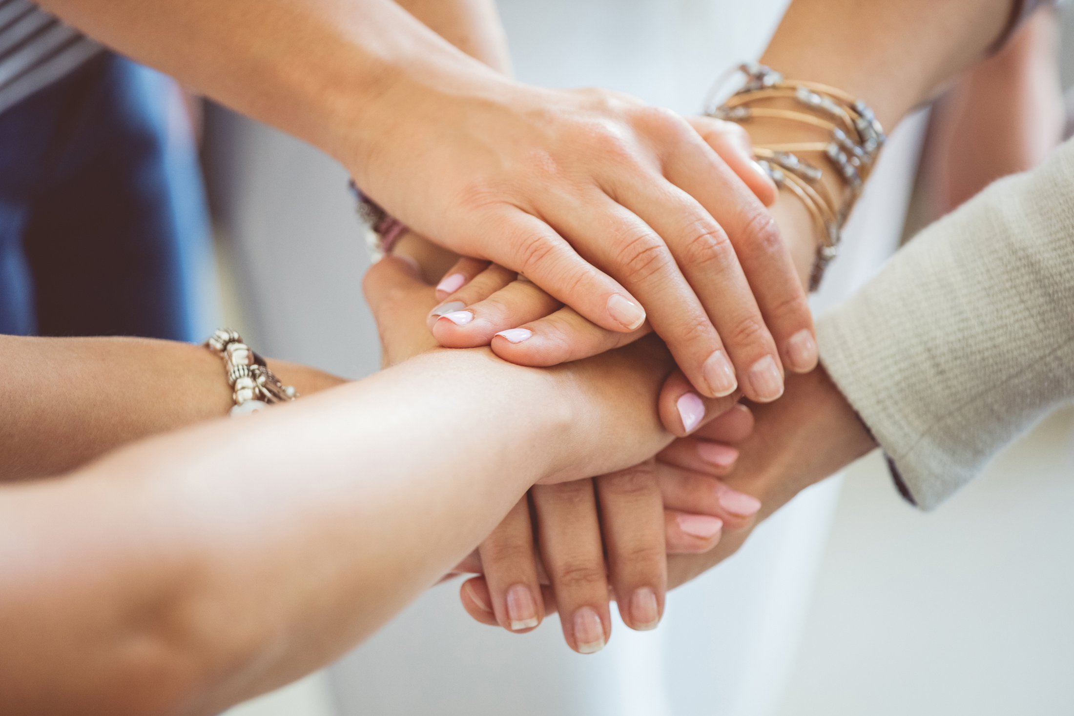 Women’s team. Women's hands together